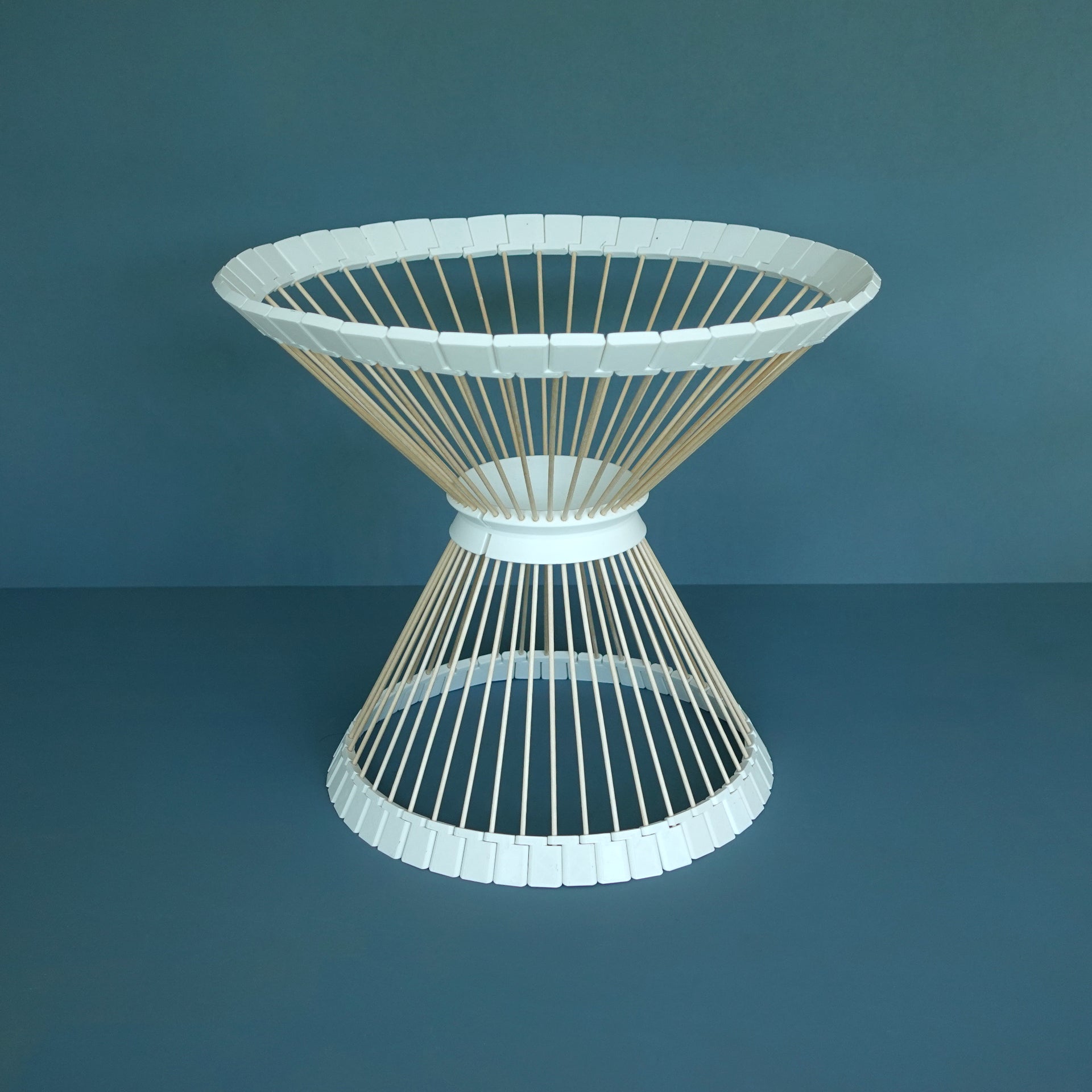 a white wicker table on a blue background