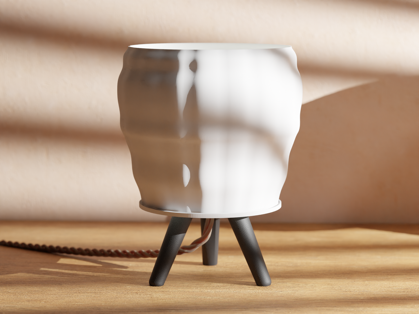 a white vase sitting on top of a wooden table