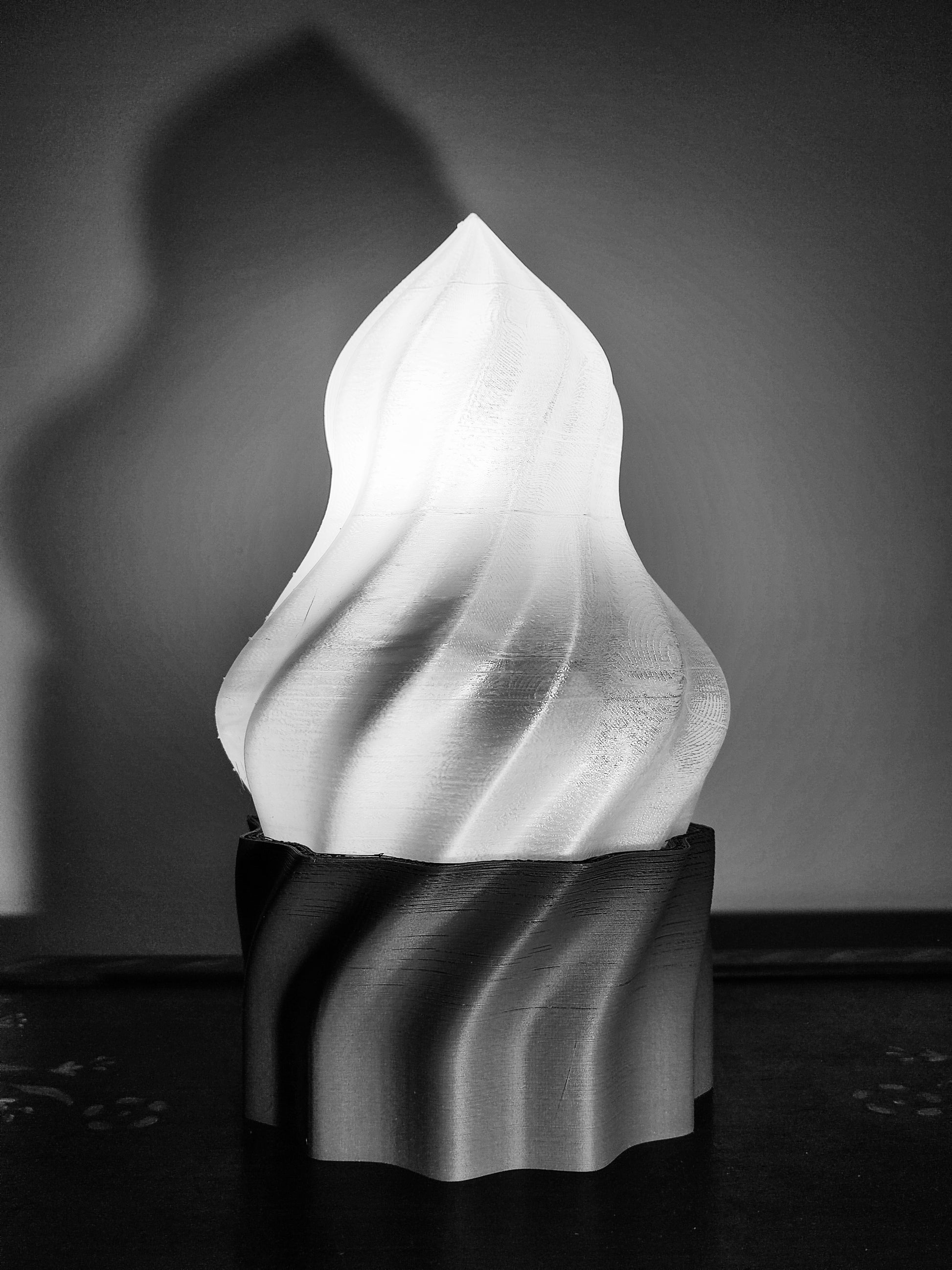 a black and white photo of a sculpture