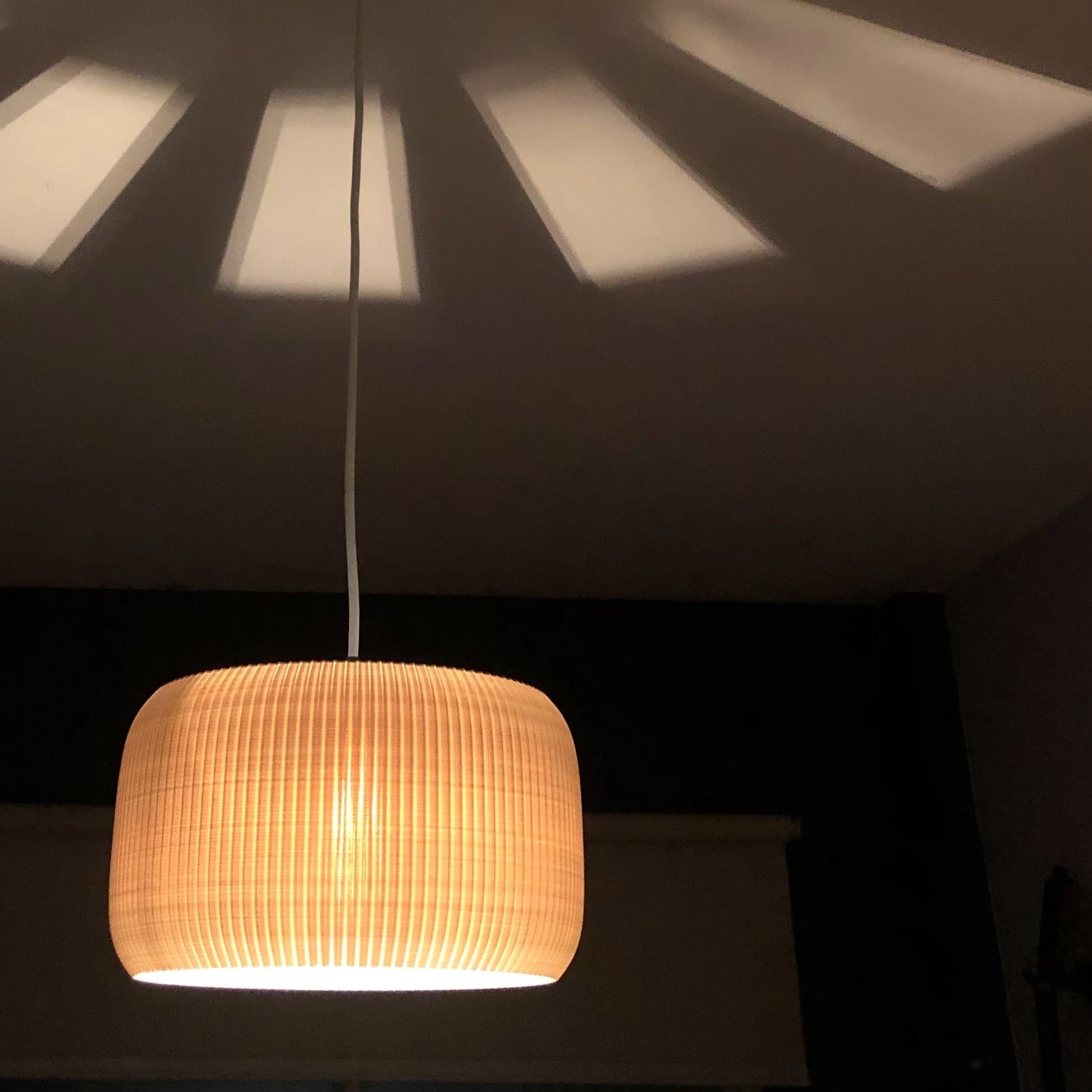 a lamp hanging from a ceiling in a room
