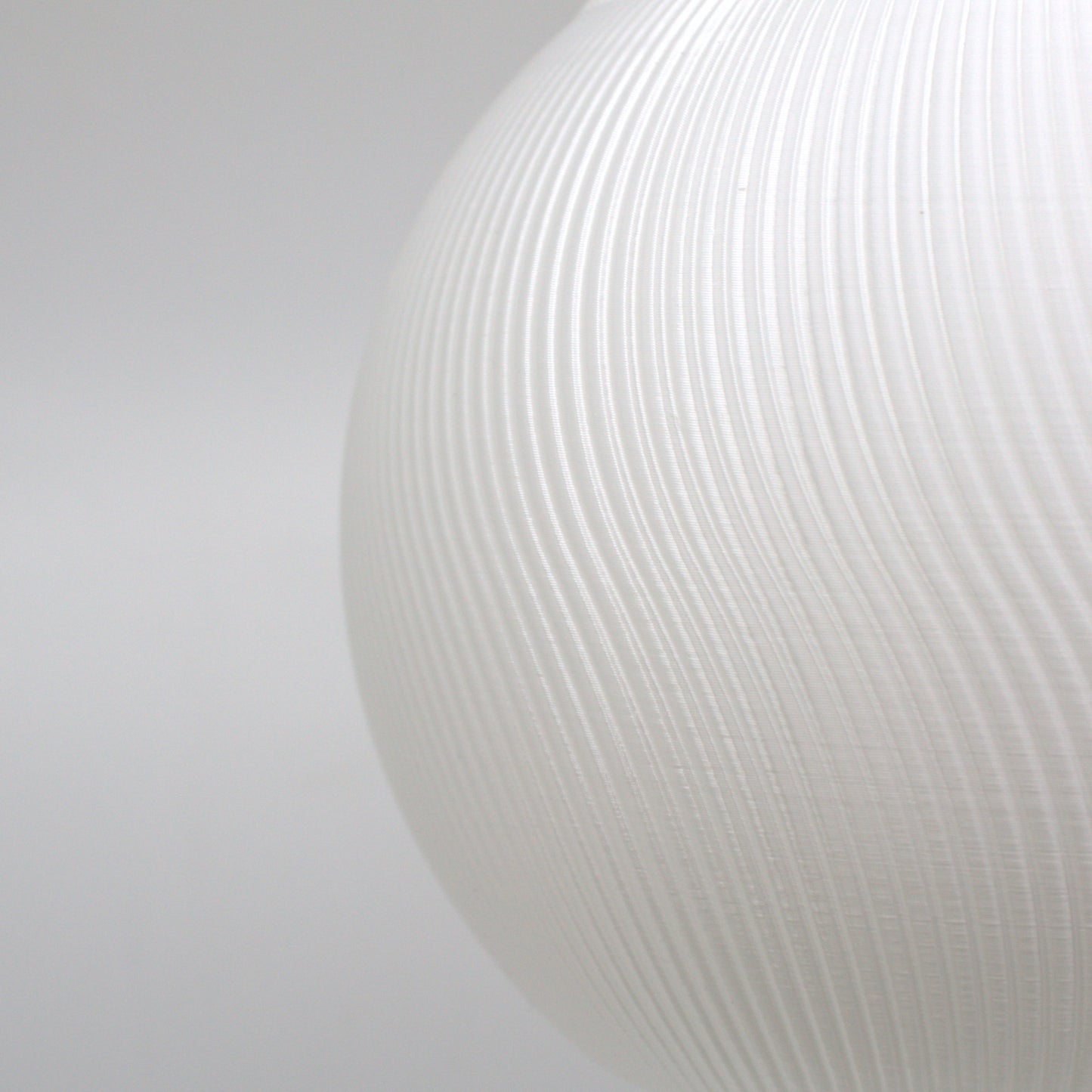 a close up of a white vase on a white background