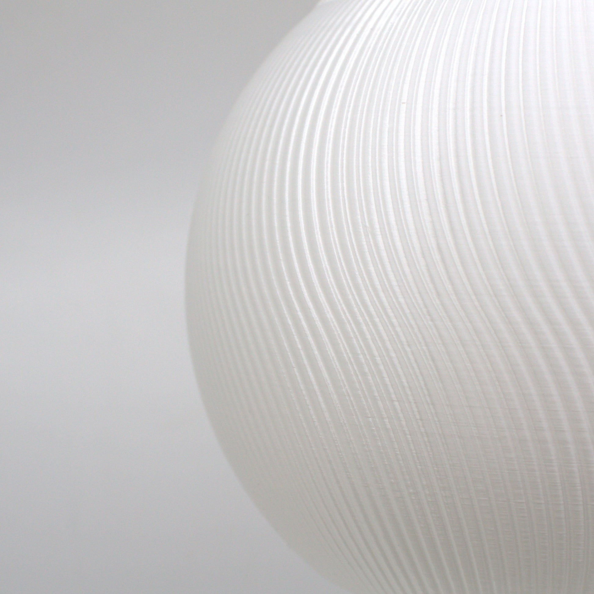 a close up of a white vase on a white background