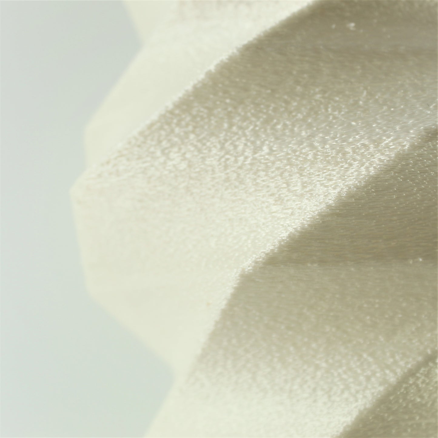a close up view of a white fabric