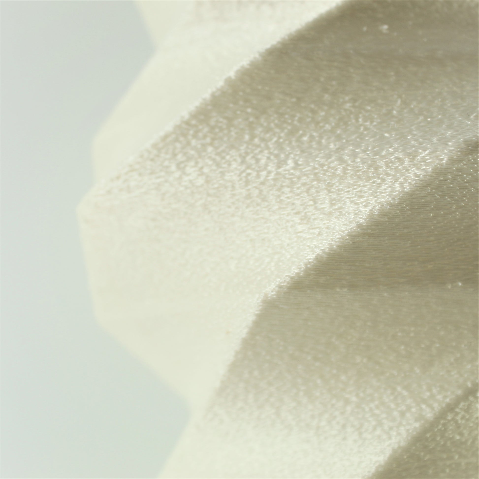 a close up view of a white fabric