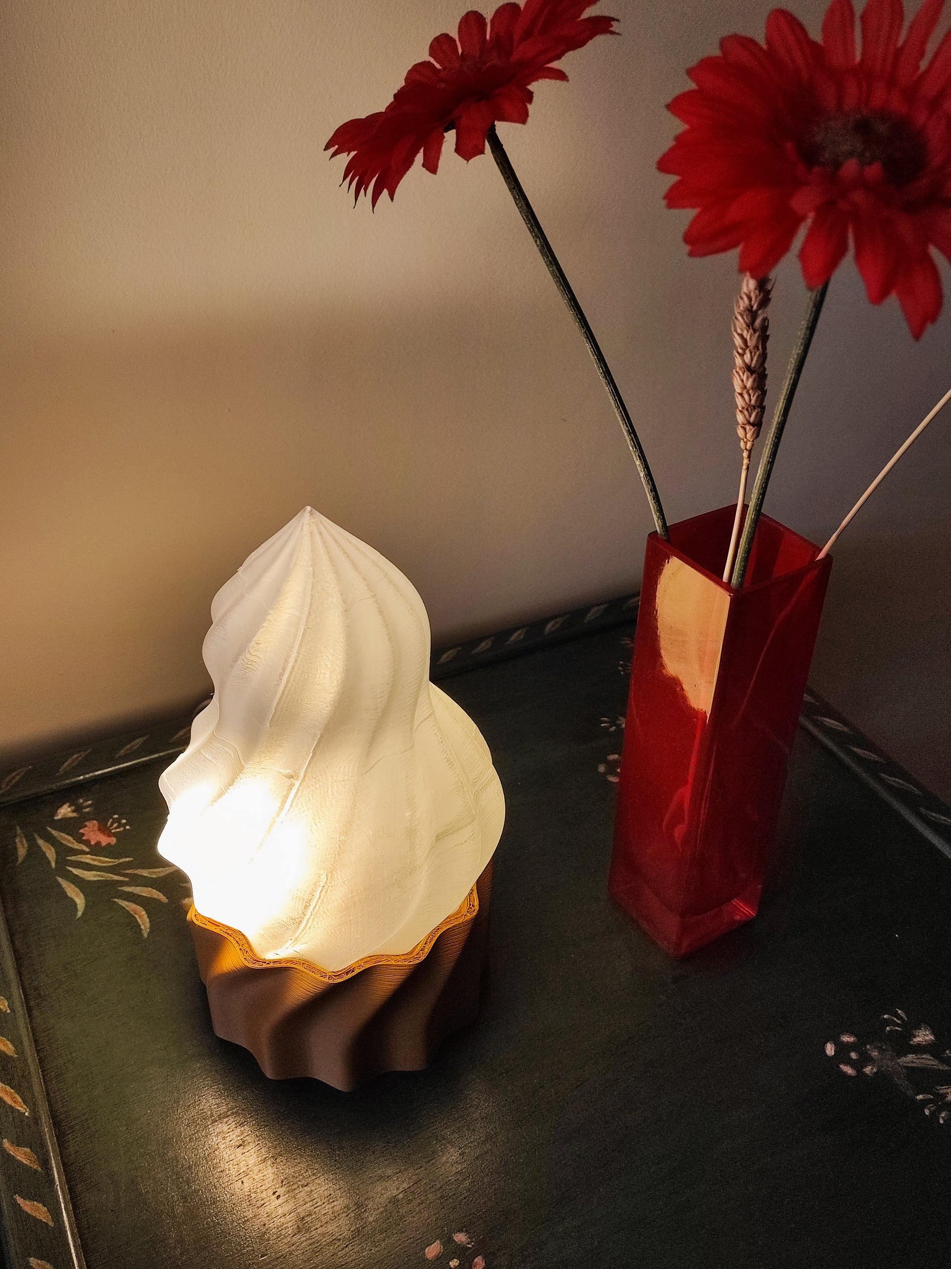 a vase with a flower and a vase with a flower in it