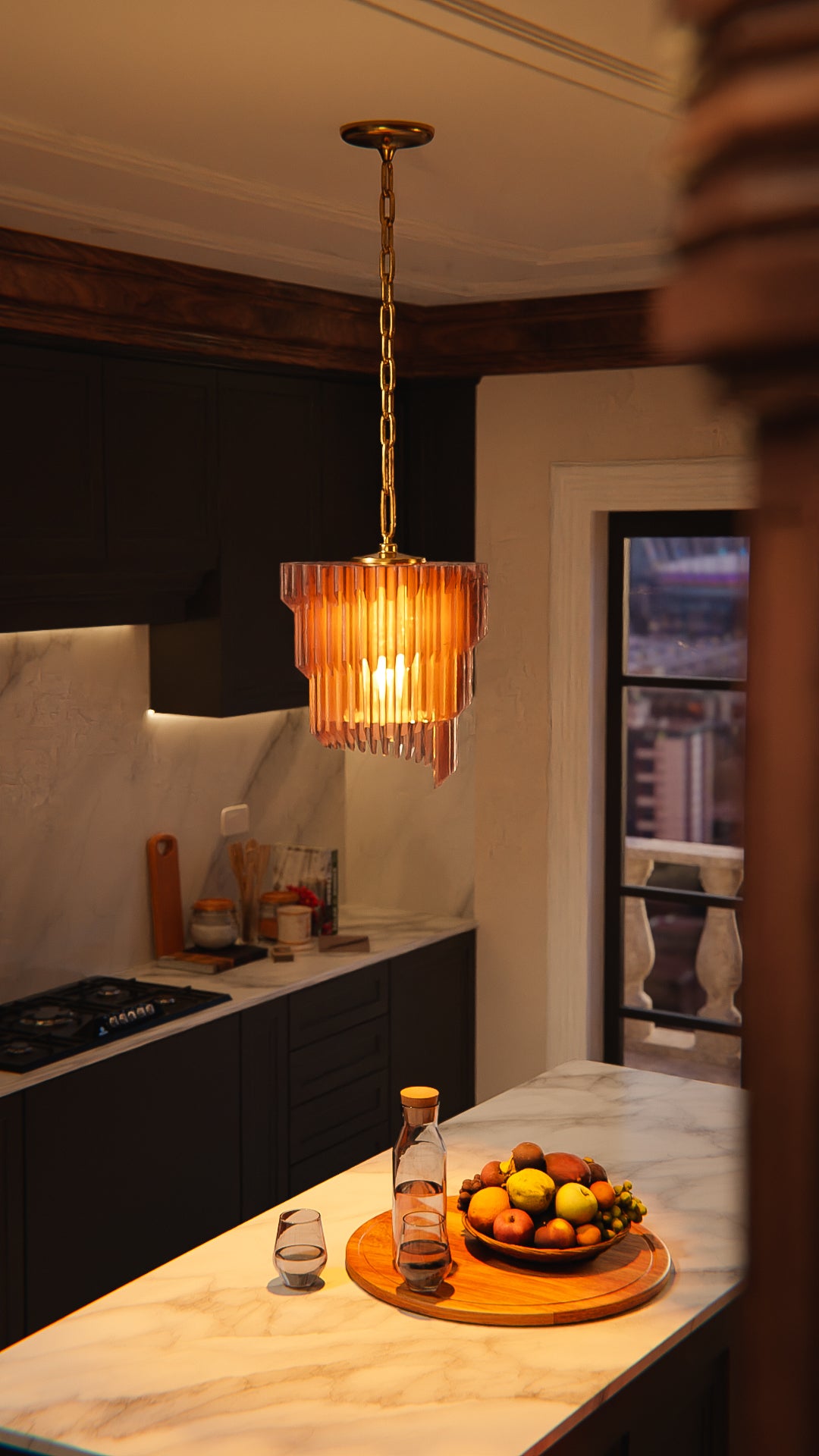 a bowl of fruit sitting on a kitchen counter