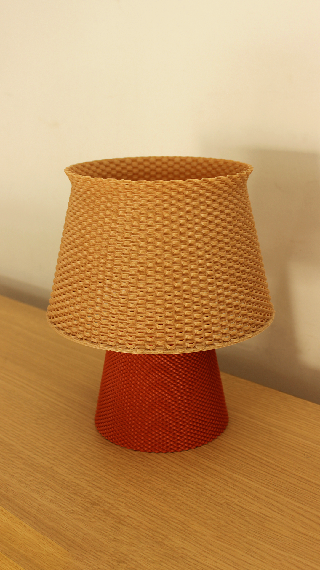 a lamp shade sitting on top of a wooden table