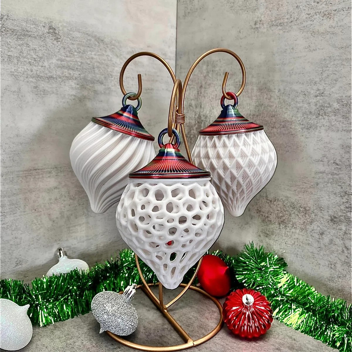 a couple of white and red ornaments sitting on top of a table