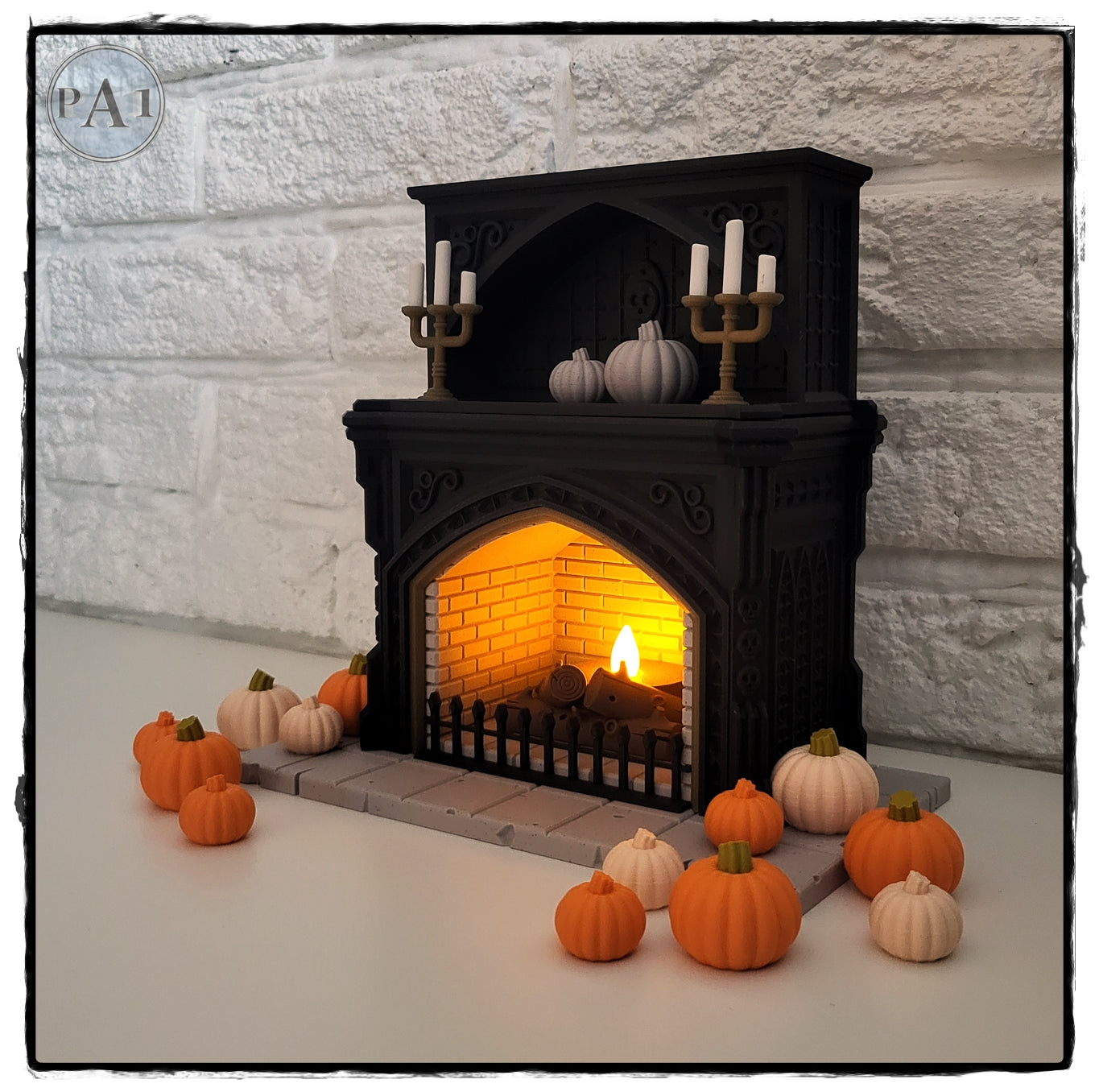 A miniature fireplace with a lit fire, surrounded by a collection of small orange pumpkins, creating a cozy and festive atmosphere.