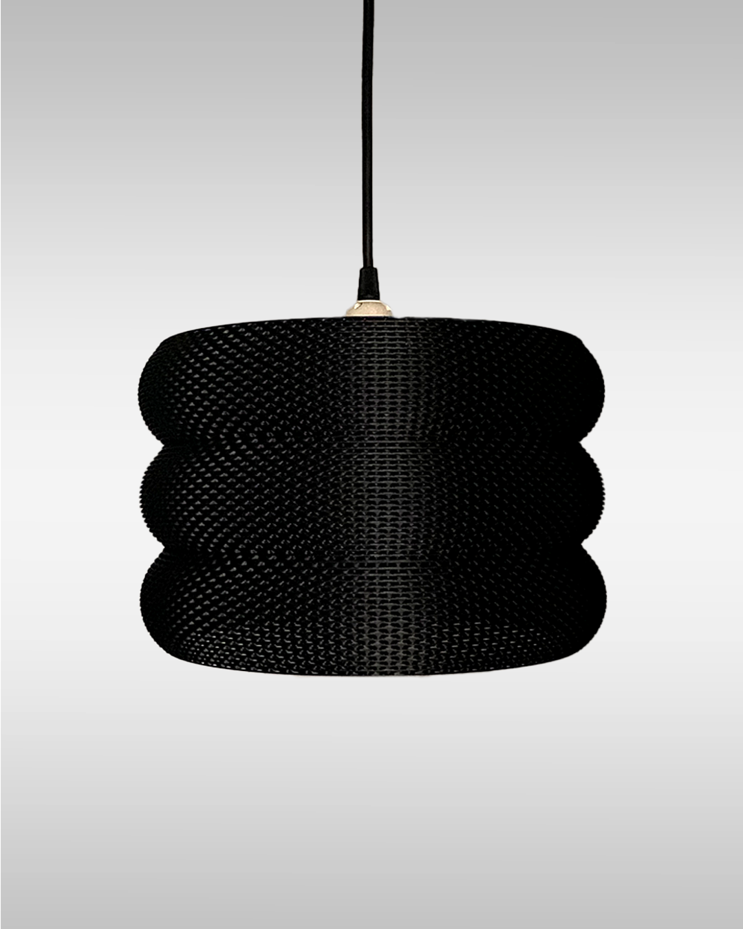 a black lamp hanging from a ceiling