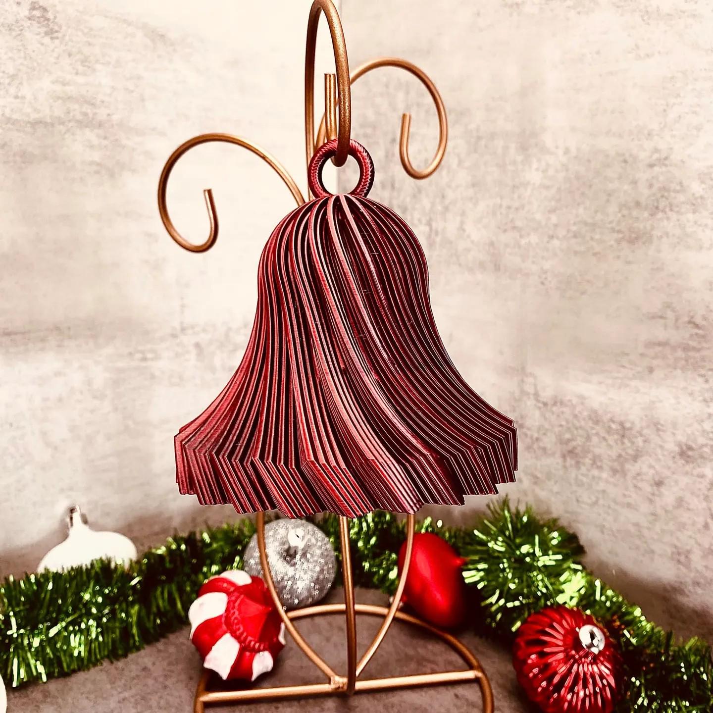 a christmas decoration with a red umbrella on a stand